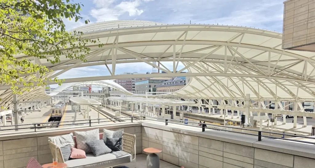 Terrace seating overlooking the train platforms and canopy at Denver Union Station